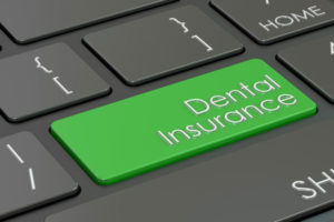 keyboard with green dental insurance key